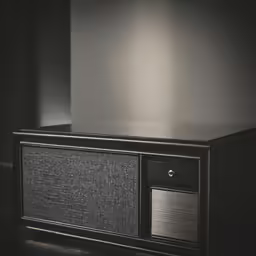 a black tv stand is open and displaying the top panel