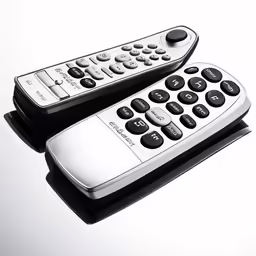 the pair of remote controls is black and white