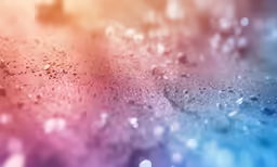 the background of a rainbow colored wallpaper