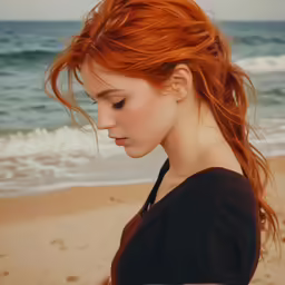 a woman with red hair standing on a beach