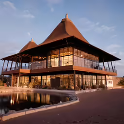 a building that is made out of wood and glass