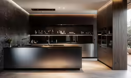 the contemporary kitchen is located next to a large open living room