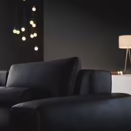 a living room filled with furniture and lighting