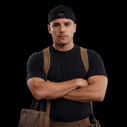 a man in black shirt and backpack standing next to bag