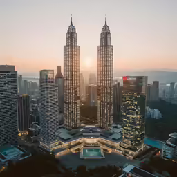 two large tall buildings sitting next to each other
