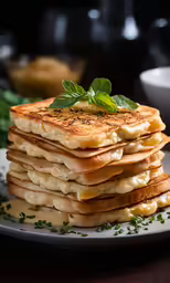 food on a white plate stacked up