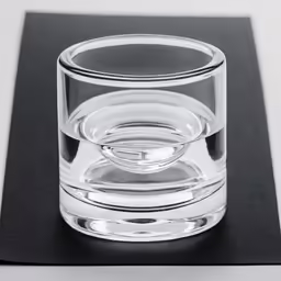 a glass sitting on top of a table