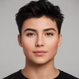 a person with short hair standing and looking up