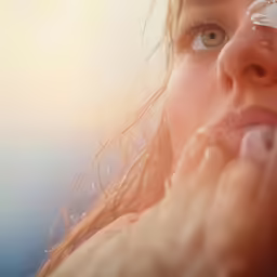 a girl with long, freckled hair and blue eyes