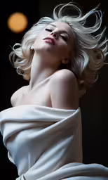 a woman with long hair in white clothing