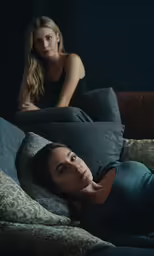 the woman is laying on her stomach while talking to the woman