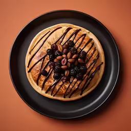 pastry on a plate topped with a drizzled sauce