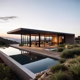 a pool and an outside dining area with glass walls
