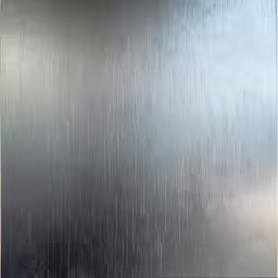 rain coming down on a wall by a door