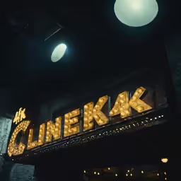 the entrance to a cinema, with the name clarks on it