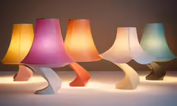 a couple of colorful lamps are in front of each other