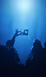 a couple of people are holding their cell phones