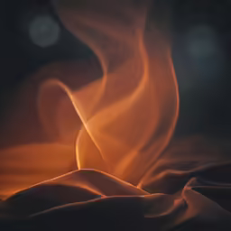 the background is black and orange with a blur