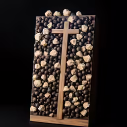 a cross made out of chocolates with cheese in it