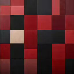 a black and red patchwork wall that has squares