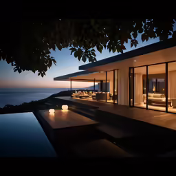 an oceanfront residence with glass walls and sliding doors