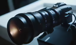 a camera lens with its light reflected off of the lens