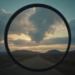 a convex looking view of a sky and clouds