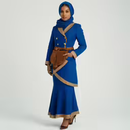 a woman in a blue dress poses for the camera