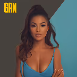 a woman posing for the camera with her hands on her breasts