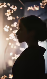 a woman looking away with bright lights in the background