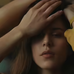 woman putting her hair on top of her head