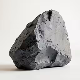 the rock is black with some white speckles on it