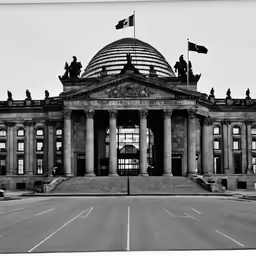 an image of the front of a building that has columns and a flag on top