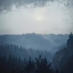 mountains and trees on a hazy day