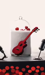 a cake with a red guitar under it