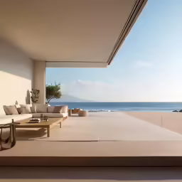 a white sofa sitting on top of a long table