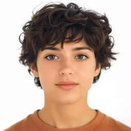 the young man has brown hair and blue eyes