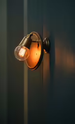 a light shining on the side of a building