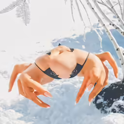 a woman wearing lingerie in the snow