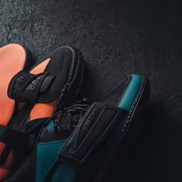 shoes with black soles and orange socks
