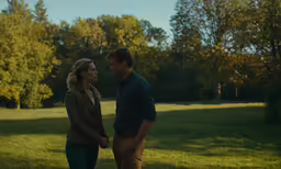 a man and woman looking into each others eyes