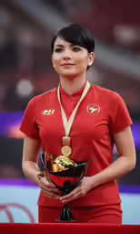 a beautiful woman in red holding up a ball