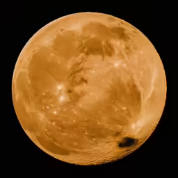 a full moon with stars in the sky