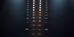 a black room with spotlights and white lights