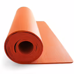 a large, orange mat of yoga, with an empty roll in the middle