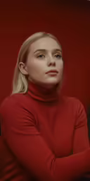 the woman in red sweater is posing for a photo