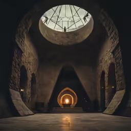 a tunnel leading to another tunnel with an open skylight