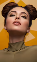 a woman wearing makeup next to an orange and white wall