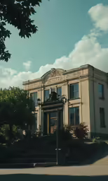 a building on the street with trees in the background