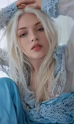 the blonde haired woman is posing for the camera